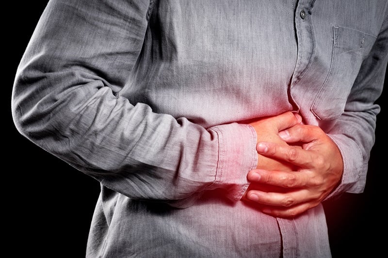 Image showing a person clutching their gut 