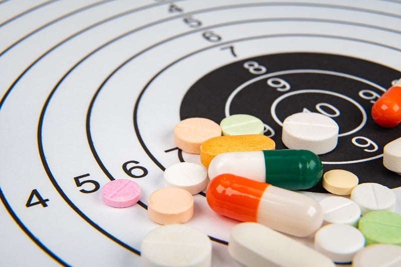 Image of pills sitting on a target board
